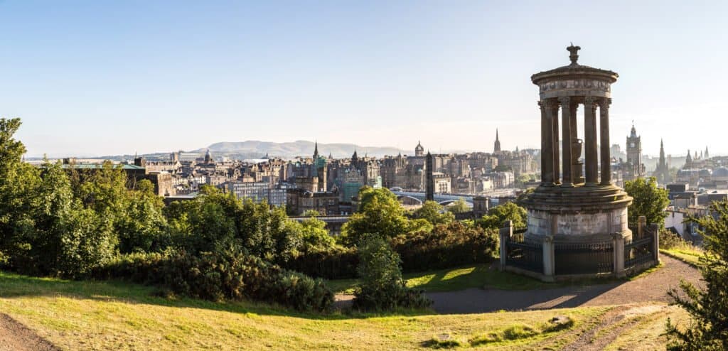 Panoramic aerial view of Edinburgh castle from Calton Hill in a beautiful summer evening, Scotland, United Kingdom