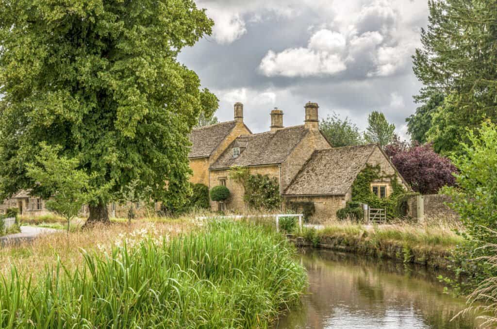 Historic stone cottages at Lower Slaughter, in the English Cotswolds