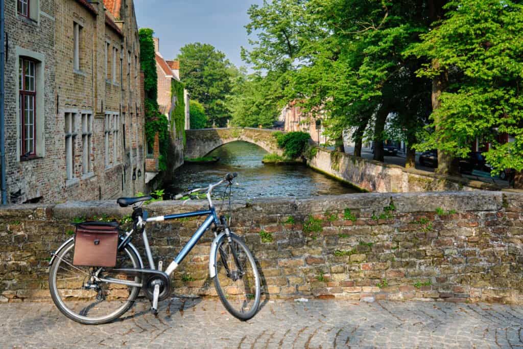 bicycle on a bridge near canal and old house. Bruges (Brugge), Belgium