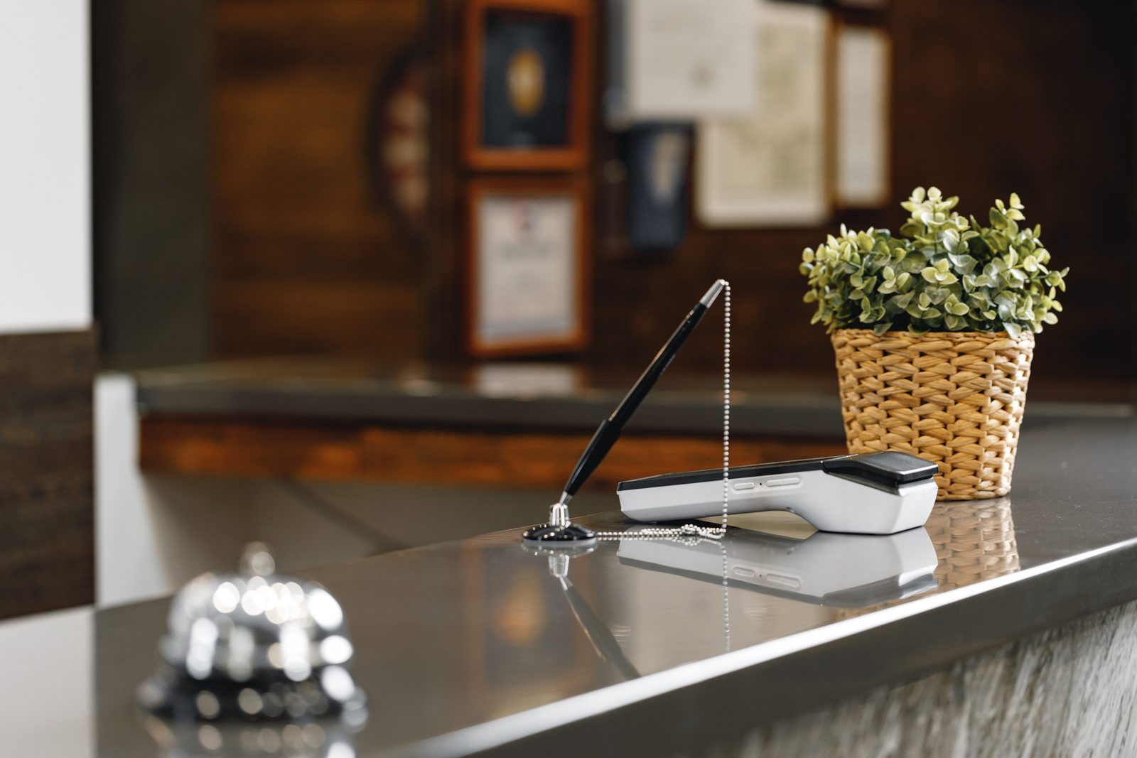 A service bell on a hotel front desk counter