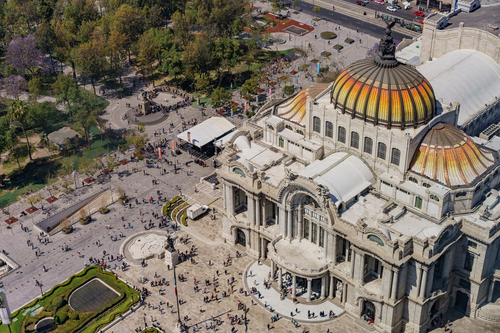 The Palacio de Bellas Artes and the Alameda Central from above, with jacarandas in flower