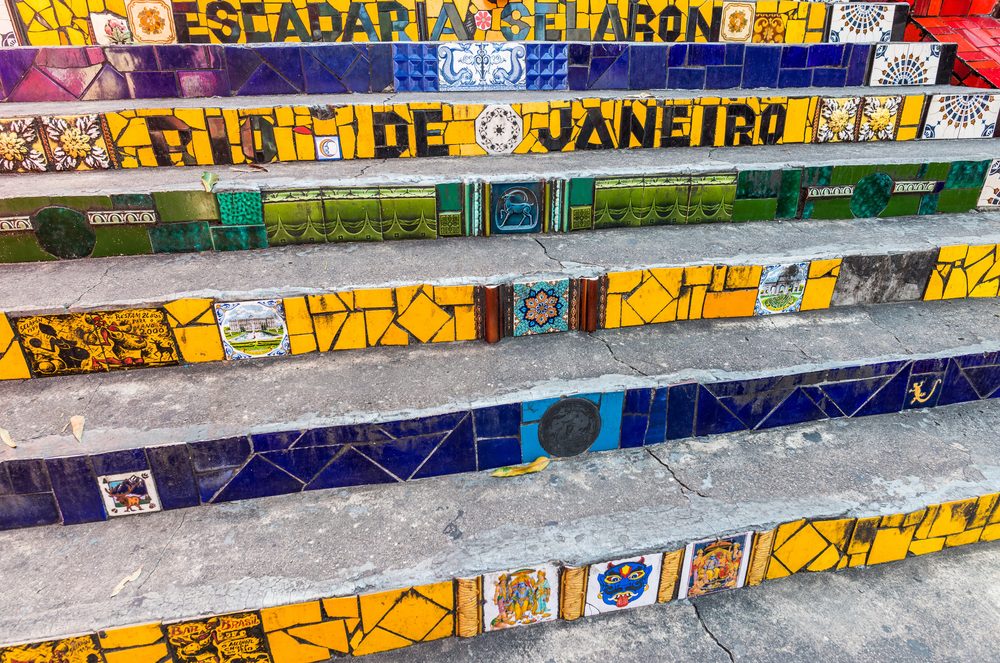 Tiled steps of the Escadaria Selaron in Lapa, spelling out Rio de Janeiro in yellow tiles