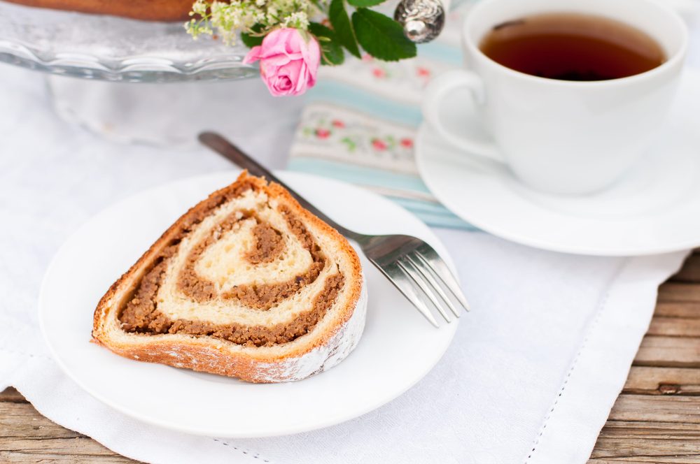 A slice of potica, the Slovenian walnut roll, served with tea